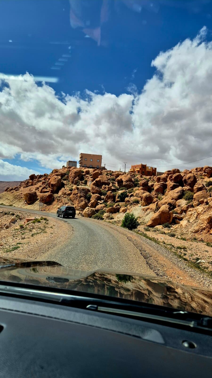Dirt road winding through red rock formations